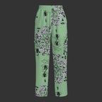 A pair of sage cargo pants with a decorative button design and multiple pockets.